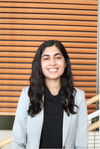 A lady smiling in professional attire