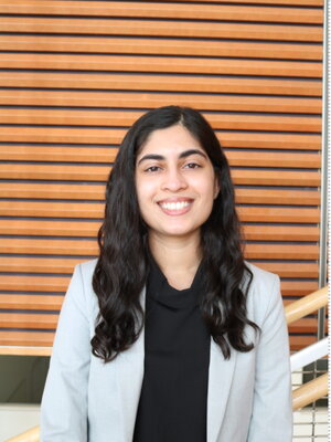 A lady smiling in professional attire